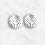 White Sunburst Charm
